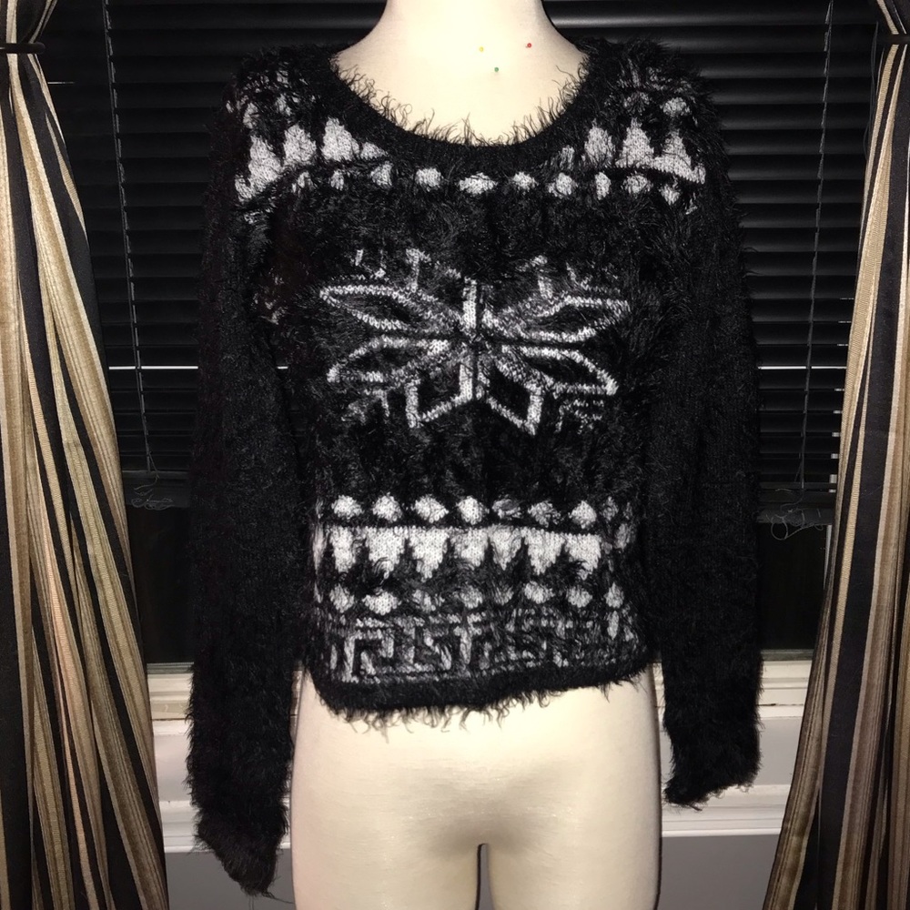 Fuzzy patterned Christmas sweater.